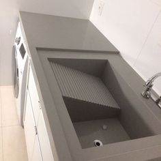 an empty kitchen with a sink and dishwasher in the center, next to a washer and dryer