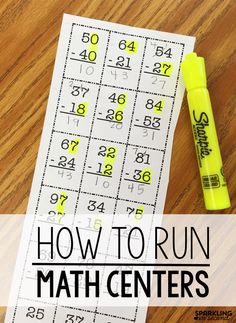 a yellow marker sitting on top of a table next to a printable math center