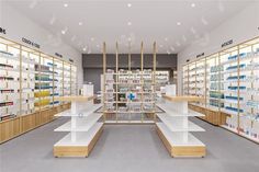 the inside of a pharmacy store with shelves full of medicine and other medical supplies on display