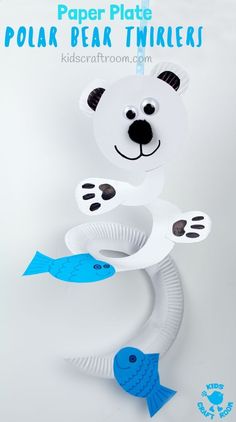 a paper plate polar bear with two fish on it's back and the words polar bear