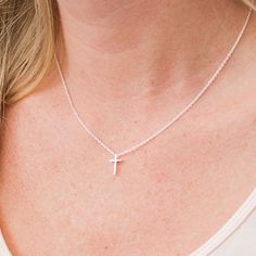 This tiny silver cross necklace is a classic addition to your layering necklaces. This minimalist necklace is also perfect by itself. The cross charm is sterling silver and measures approximately 12 mm in length or 1/2 inch. The chain is delicate looking but sturdy sterling silver. This dainty cross necklace is available in lengths from 15 - 18 inches. You may choose to add an attached extender. Your new necklace will come in a box, ready for gift giving. More Christian jewelry https://www.etsy. Minimalist Cross Pendant Necklace For Everyday, Dainty Cross Necklace For Everyday Wear, Minimalist Cross Pendant Necklace For Everyday Wear, Delicate Sterling Silver Cross Pendant Necklace, Dainty Silver Crucifix Necklace, Minimalist Cross Necklace For Everyday, Dainty Cross Necklace With Delicate Chain For Everyday, Dainty Everyday Cross Necklace With Delicate Chain, Sterling Silver Necklace With Delicate Cross Pendant