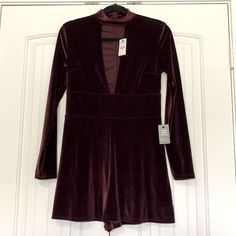 Woman’s Express Velvet Wine Colored Romper. Size Small. Deep V In Front, Zips Up Back. Long Sleeves. Brand New Never Worn. Fitted Jumpsuits And Rompers For Fall Date Night, Fitted Burgundy Jumpsuits And Rompers, Fitted Jumpsuits And Rompers For Going Out In Fall, Blush Pink Jumpsuit, Black Strapless Jumpsuit, Black Sleeveless Jumpsuit, One Piece Jumper, Denim Overalls Shorts, One Shoulder Jumpsuit