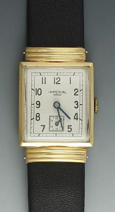 "Offered in this sale is a classic 1930's man's Art Deco watch by the Imperial Watch Co.. The rectangular case is accented at both ends with ribbed gold bands or hooded lugs that cover the strap pins, and with a domed crystal, that give this watch its strong Art Deco lines. Matte finish champagne dial with black Arabic numeral chapters and subsidiary second hand. The stem wind and set movement in excellent working order and fully guaranteed for 30 days. On brand new diamond finish calf leather s Art Deco Lines, Art Deco Watch, Silver Tea Set, Saltwater Pearls, White Gold Sapphire, Sterling Silver Charm Bracelet, Silver Tea, Gold Art Deco, Sapphire Bracelet