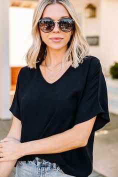 Don't wait to get your hands on this fabulous top! It's so classic and chic! We love how easy and versatile this top it! You can tuck it, knot it, or let it fly! No matter what you chose it's sure to look amazing! This top feature short sleeves, a v-neck, and classic fit. Material has no amount of stretch. Cam is wearing the small. Versatile V-neck Top For Day Out, Chic Summer V-neck Top For Everyday, Chic Tops For Day Out, Versatile Black Tops For Vacation, Chic Everyday V-neck Blouse, Chic Black Top For Vacation, Chic Black V-neck Top With Short Sleeves, Mint Julep Boutique, Mint Julep