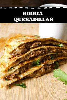 a close up of a quesadilla on a cutting board with the words burritoa quesadillas