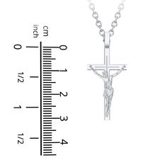 Made in sterling silver, this meaningful crucifix necklace is a beautiful symbol of faith. White Gold Crucifix Necklace Spiritual Style, Spiritual White Gold Crucifix Cross Necklace, Spiritual White Gold Crucifix Necklace, Classic White Gold Crucifix Necklace, White Gold Crucifix Necklace, Classic Engraved Crucifix Necklace, Classic Sterling Silver Cross Charm, Elegant Sterling Silver Crucifix Necklace, Spiritual Hallmarked Crucifix Necklace