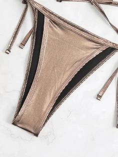 Indulge in a seductive and daring look with our Glamorous Metallic Underboob Micro Bikini Set. The cut out design highlights your underboob, adding a bold and alluring touch to your beach style. Show off your confidence in this must-have bikini set! Material: Polyester Metallic Swimsuit, Cut Out Design, Show Off, Beach Style, Cut Out, Highlights, Confidence, Design