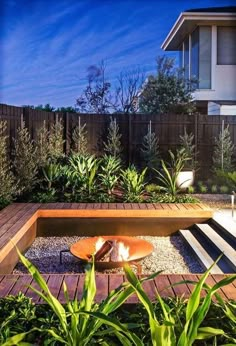 a wooden bench sitting in the middle of a garden