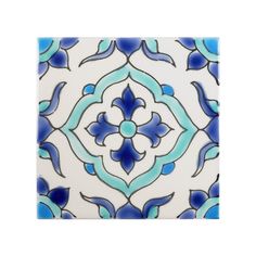 a blue and white tile with an intricate design on the back side, in square shape