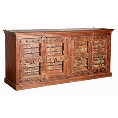 an old wooden sideboard with many drawers and knobs on the doors, made out of wood