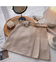 Chic Beige Skirt With Belt Loops, Chic Solid Beige Skirt, Beige Skirt For Office, Beige Solid Color Skirt For Office, Elegant Beige Skirt With Belt Loops, Elegant Beige Belted Skirt, Beige Solid Color Office Skirt, High Waist Belted Beige Skirt, Belted High Waist Beige Skirt