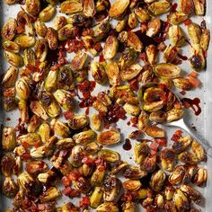 roasted brussel sprouts with cranberry sauce on a baking sheet