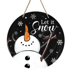 a black and white sign with a snowman wearing a carrot on it's head