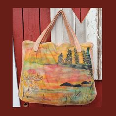 The 'Moose by the Lake' scene in beautiful Småland, southern Sweden has been hand painted onto this bag. The proud moose and a few grasses on the shore are embroidered. The shopper/weekender is unique, there is only one of it worldwide. The leather feels very soft and supple. Inside the bag is lined with fabric, there you will also find a leather cosmetics bag, which is connected with a carabiner and leather strap and is detachable. I have also integrated a lanyard that you can remove. So you do Artistic Leather Travel Bag, Artistic Travel Satchel Shoulder Bag, Hand Painted Satchel Bag For Everyday Use, Artistic Satchel Shoulder Bag For Travel, Hand Painted Shoulder Bag For Travel, Rectangular Hand Painted Travel Shoulder Bag, Hand Painted Tote Shoulder Bag For Everyday, Artistic Leather Tote Bag, Everyday Hand Painted Tote Shoulder Bag