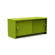 a green cabinet sitting on top of a white wall