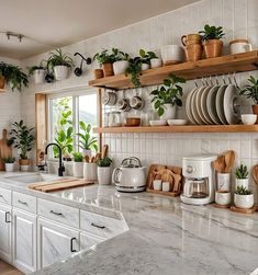 the kitchen counter is covered with pots and pans