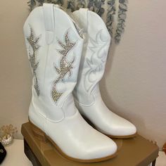 = White Embellished Snip Toe Boots, Western Rhinestone Boots With Round Toe, Western Boots With Rhinestones And Round Toe, Western White Embellished Boots, White Embellished Boots With Round Toe, Glamorous White Embellished Boots, White Snip Toe Party Boots, White Rhinestone Boots With Round Toe, Glamorous White Boots With Rhinestones