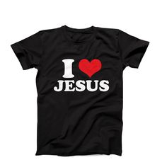 "I love Jesus T-Shirt, Christian Tee, I Heart Jesus T-Shirt, Faith-inspired Shirt, Christian Gift idea, Jesus Christ Tee, Love Jesus Tee Are you in search of a unique and personalized custom t-shirt? Well, your search ends here! We take immense pride in offering the widest range of I heart t-shirts available on the internet. But that's not all - if you don't find something that catches your eye, fret not! We would be absolutely delighted to customize a flawless I heart tee just for you. Simply c Black Slogan T-shirt For Valentine's Day, Valentine's Day Black Slogan T-shirt, Valentine's Day Black T-shirt With Text Print, Valentine's Day Black T-shirt With Slogan, Valentine's Day Short Sleeve Slogan T-shirt, Valentine's Day Slogan T-shirt With Short Sleeves, Valentine's Day Slogan T-shirt Short Sleeve, Valentine's Day T-shirt With Slogan And Short Sleeves, Black Top With Funny Text For Valentine's Day