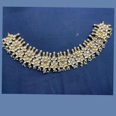 The listing includes a choker only. Made by order. Kindly allow 8-9 weeks for the delivery of this item. For custom or urgent requests, please contact support@alacouture.com. *Please Note: We use faux stones and beads in all of our jewelry. Ceremonial Temple Jewelry Choker With Stone Work, Jeweled Kundan Choker Necklace, Gold Choker With Stone Work, Kundan Metal Choker For Wedding, Tilla Choker Necklace For Party, Kundan Bridal Choker Necklace For Parties, Silver Choker For Reception, Silver Jeweled Choker For Wedding, Hand Set Bridal Choker For Party