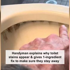 an old man is using a toilet seat to fix it