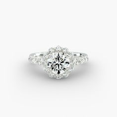 a diamond engagement ring on a white background