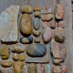 various rocks and stones laid out on a wooden surface