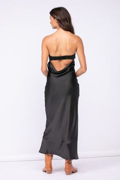 The Irene Black Satin Strapless Maxi Dress is the perfect date night dress! Black satin fabric shapes this strapless maxi dress with a cowl back and a ruched elastic strap. Pair with some gold jewelry and strappy heels for a night out on the town. DETAILS & CARE 95% Polyester/ 5% Spandex Hand wash cold. Imported. Chic Maxi Dress With Cowl Back For Party, Chic Gala Maxi Dress With Cowl Back, Glamorous Strapless Dress With Ruched Bodice For Date Night, Summer Evening Maxi Dress With Cowl Back, Chic Maxi Dress With Cowl Back For Gala, Chic Cowl Back Maxi Dress For Gala, Summer Maxi Dress With Cowl Back For Night Out, Ruched Maxi Evening Dress For Night Out, Backless Midi Dress With Ruched Bodice For Night Out