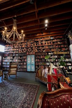 a room filled with lots of books and furniture