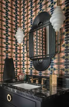 a bathroom with a sink, mirror and wall paper in it's design style