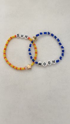 two bracelets with the word sun and moon written on them, both made from plastic beads