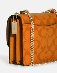 Signature coated canvas and smooth leatherInside multifunction and zip pocketsSnap closure, fabric liningOutside open pocketHandles convert to shoulder strap with 22" drop7" (L) x 5 1/4" (H) x 2" (W)Style No. C9946Color: Light Orange Luxury Orange Coach Bag, Luxury Orange Coach Shoulder Bag, Coach Bag Orange, Coach Hudson Small Pack, Orange Guess Duffel Crossbody Purse, Mini Pepper Crossbody Coach, Coach Crossbody Bag Yellow, Lighted Canvas, Signature Canvas