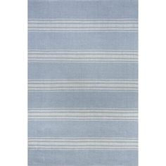 a blue rug with white stripes on it