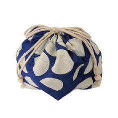 a blue and white polka dot bag with rope handles