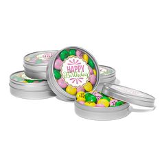 four tins filled with candies on top of each other