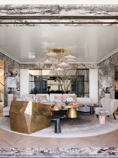 a living room filled with furniture and a chandelier