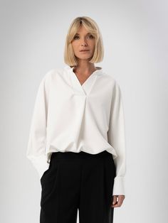 White Classy V Neck Shirt, Formal Viscose Blouse, Long Bishop Sleeves Work Top, Office Attire, Loose Oversized Blouse, White Work Classy Top. Meet our oversize white shirt made from natural viscose fabric and feature long sleeves. Whether you're looking for summer clothing or a thoughtful gift for women, minimalist design shirts are the best choice. Such a blouse will complement any style and seamlessly fits cargo pants, maxi skirt or leather jacket. Advantages:  ⁃ Suitable for all body types an Versatile V-neck Workwear Shirt, Versatile V-neck Work Shirt, Classic V-neck Relaxed Fit Blouse, Classic V-neck Blouse With Relaxed Fit, Classic Oversized V-neck Top, Oversized Long Sleeve Tops For Workwear, Versatile Oversized V-neck Blouse, Oversized Versatile V-neck Blouse, Oversized Collar Blouse For Work