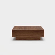 a wooden box sitting on top of a white surface