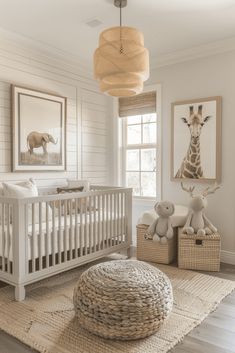 a baby's room with a giraffe print on the wall and stuffed animals in baskets