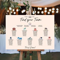 the seating chart is displayed on an easel for guests to take in their seats