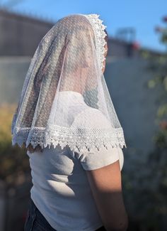 This is a D Shape Veil. This veil was made with a soft dot mesh lace fabric and is embellished with an offwhite trim around the edges.  It measures approx  38 x 19 inches The veil includes a sewn-in clip.  Veils are all handmade so no two pieces will be identical.  Please allow 3-7 business days for the order to be processed and shipped. Washing recommendations: Wash with cold or warm water by hand. Hand dry or tumble dry in low-medium heat. We recommend washing the veil before being used since the fabric was not prewashed before making the veil. If you have any questions about this veil don't hesitate to message me. Please keep in mind that the color may vary due to differences in computer/phone screens. I do accept returns the return window is 7 days therefore contact me as soon as possi White Lace With Lace Collar For Spring, Fitted Sheer White Veil, Fitted White Veil, White Lace Trim Tulle, White Fitted Lace Veil, White Lace With Contrast Detail For Summer, White Sheer Lace For Spring, Fitted White Lace Veil, Spring Sheer White Lace