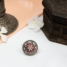 This ring is made in 925 Sterling silver with pink and white kemp stone. This is an adjustable ring will looks good with all casual and occasional outfits. Pair it with any floral outfit and add a dash of exuberance to your look. This piece has been delicately handcrafted by skilled craftsmen who are carrying forward and sharing the Traditional Mughal art of Jewelry making with the entire world. Gross Weight: 13.00 gms Packaging and Shipping Your item is packed very carefully to avoid any in-tra Traditional Pearl Ring Gift, Traditional Round Pearl Ring For Gift, Traditional Sterling Silver Ruby Ring Gift, Handmade Temple Jewelry Style Round Ring, Temple Jewelry Style Round Rings For Celebrations, Ceremonial Multi-stone Ring Jewelry, Ceremonial Multi-stone Jewelry Ring, Silver Ceremonial Toe Ring, Sterling Silver Temple Jewelry Toe Ring