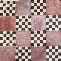 a checkerboard pattern is shown in black, white and brown colors on the floor