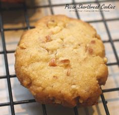 two cookies sitting on top of a cooling rack