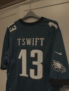 the philadelphia eagles jersey is hanging on a hanger