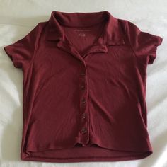 Super Cute Ribbed Button Up Shirt From American Eagle! Slightly Cropped, Marked As A Small, Would Fit An Xs/S. Nwot, Never Worn! Ask Me Questions / Make Offers Fall Short Sleeve Tops With Snap Buttons, Casual Button-up Top With Snap Buttons, Cotton Collared Top With Buttons, Cotton Tops With Collared Neckline And Buttons, Trendy Collared Tops With Button Closure, Solid Casual Button-up Tops, Casual Solid Button-up Tops, Trendy Tops With Button Closure And Collared Neckline, Trendy Top With Button Closure And Collared Neckline