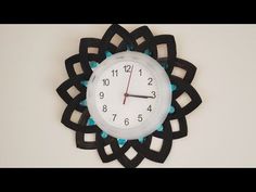 a clock that is on the wall with numbers in front of it's face