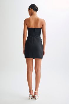 Classic, redefined.The ABBIE Strapless Suiting Mini Dress is a chic and sophisticated piece designed to make a statement. Featuring a straight neckline and strapless design, this dress exudes elegance and modernity. The double-breasted button design adds a touch of classic tailoring, while the centre back invisible zip ensures a seamless fit. Although the pockets are non-functional, they contribute to the dress's stylish aesthetic. Fully lined for comfort, the bodycon fit with a relaxed hem and Fitted Sleeveless Off Shoulder Gala Dress, Chic Off-shoulder Corset Dress For Date Night, Fitted Off-shoulder Tube Top For Date Night, Elegant Bodycon Mini Strapless Dress, Strapless Bodycon Mini Dress For Formal Occasions, Sleek Fitted Strapless Dress For Cocktail Occasions, Sleek Fitted Strapless Dress For Cocktail, Elegant Bodycon Strapless Dress With Sweetheart Neckline, Chic Fitted Strapless Off Shoulder Dress