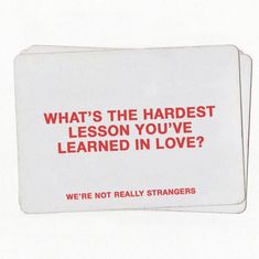 a white card with red writing that says, what's the hardest lesson you've learned in love? we're not really strangers