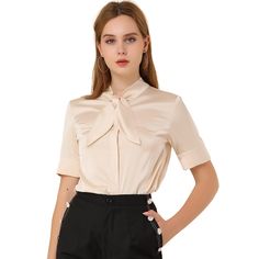 This shirt looks applicable to everyday work clothes in addition to dress-up. The silky fabric shapes this shirt with a tie-neck collared neckline and short sleeves. The curved hem gives it a neat finish over pants. The tie-neck adds casual-inspired sophistication, while soft fabric gives it an elegant, feminine shape. This elegant satin shirt features a tie-bow neck and short sleeves, making it a versatile addition to your wardrobe. Suitable for various occasions including work, office, formal Patch Work Blouse Designs, Business Casual Blouse, Tie Neck Shirt, Patch Work Blouse, Elegant Feminine, Tie Neck Blouse, Satin Shirt, Work Tops, 50s Fashion