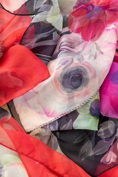 Named after the famous piazza in Rome, Campo de' Fiori (field of flowers), this sheer silk Georgette long scarf has a floral print. 100% Made in Como, Italy. Figure flattering size: Approx. 20” x 67". Years of trial and error taught us that this size scarf is one of the simplest to style and makes every woman look chic. 100% Silk Georgette: A lightweight, sheer crepe-style fabric characterized by its crinkly, pebbly texture and excellent drape that is often used in high-end fashion. It has a dul Silk Scarves With Floral Print For Spring, Red Floral Print Silk Scarf For Spring, Red Floral Print Silk Scarf, Red Silk Scarf With Floral Print, Silk Floral Print Scarves For Summer, Spring Flower Silk Scarf, Italian Silk Scarf, Long Silk Scarf, Trial And Error